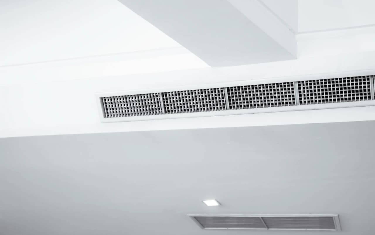 Bulkhead air conditioning system integrated into an interior ceiling