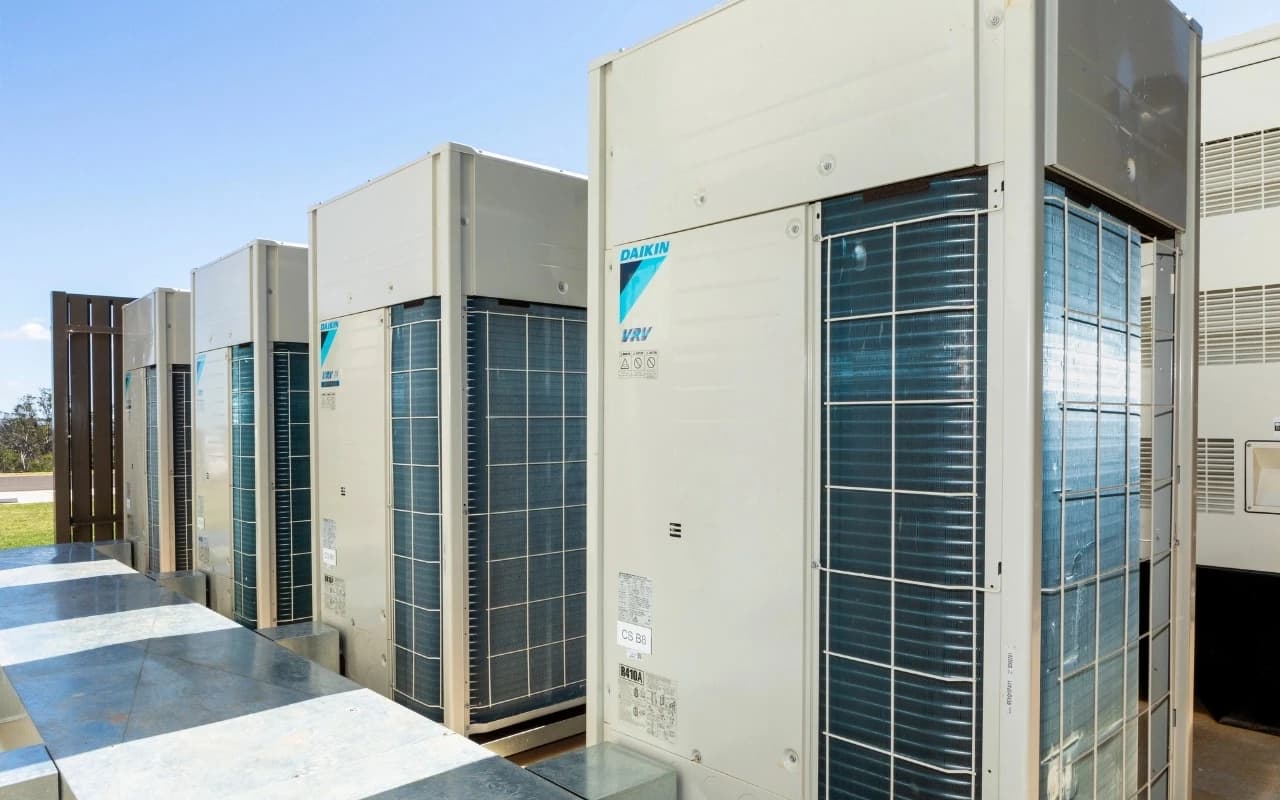 Daikin VRV outdoor air conditioning units installed in a commercial plant area
