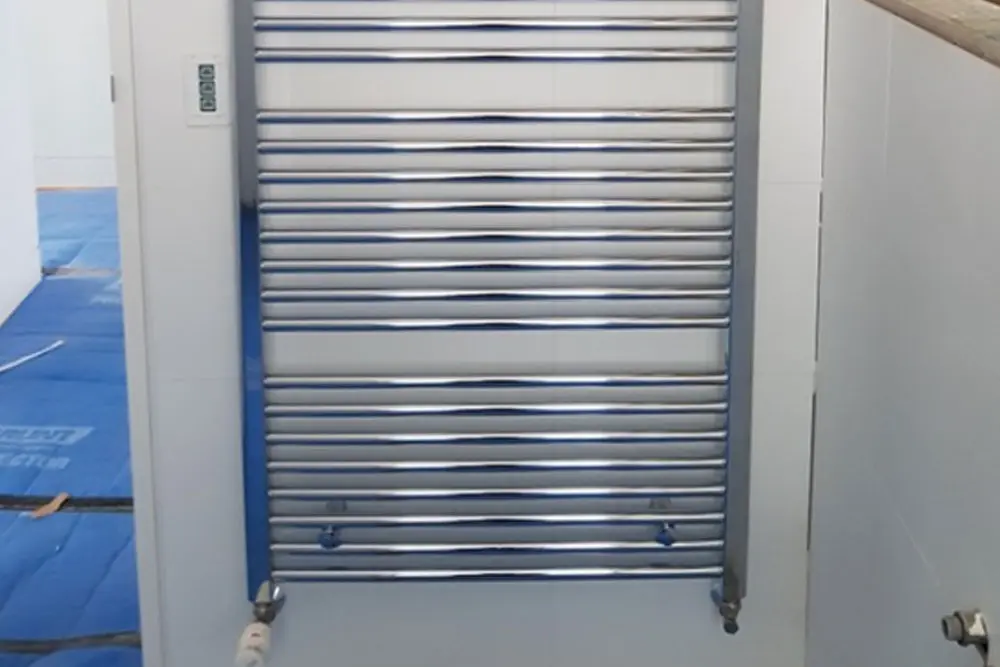 Hydronic heated towel rail installed in a bathroom