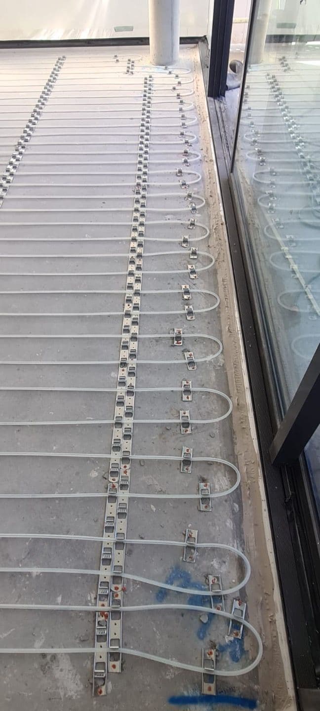 10mm hydronic in-screed heating pipes installed across an open-plan area in a Bronte residence.
