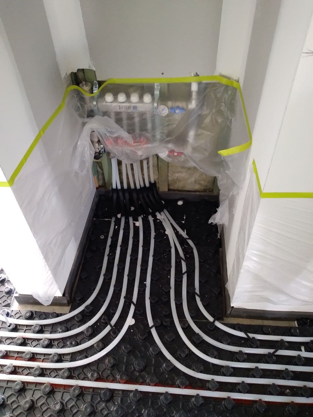 Hydronic underfloor heating pipes connected to a manifold over Profi Duo boards in South Bowenfels.