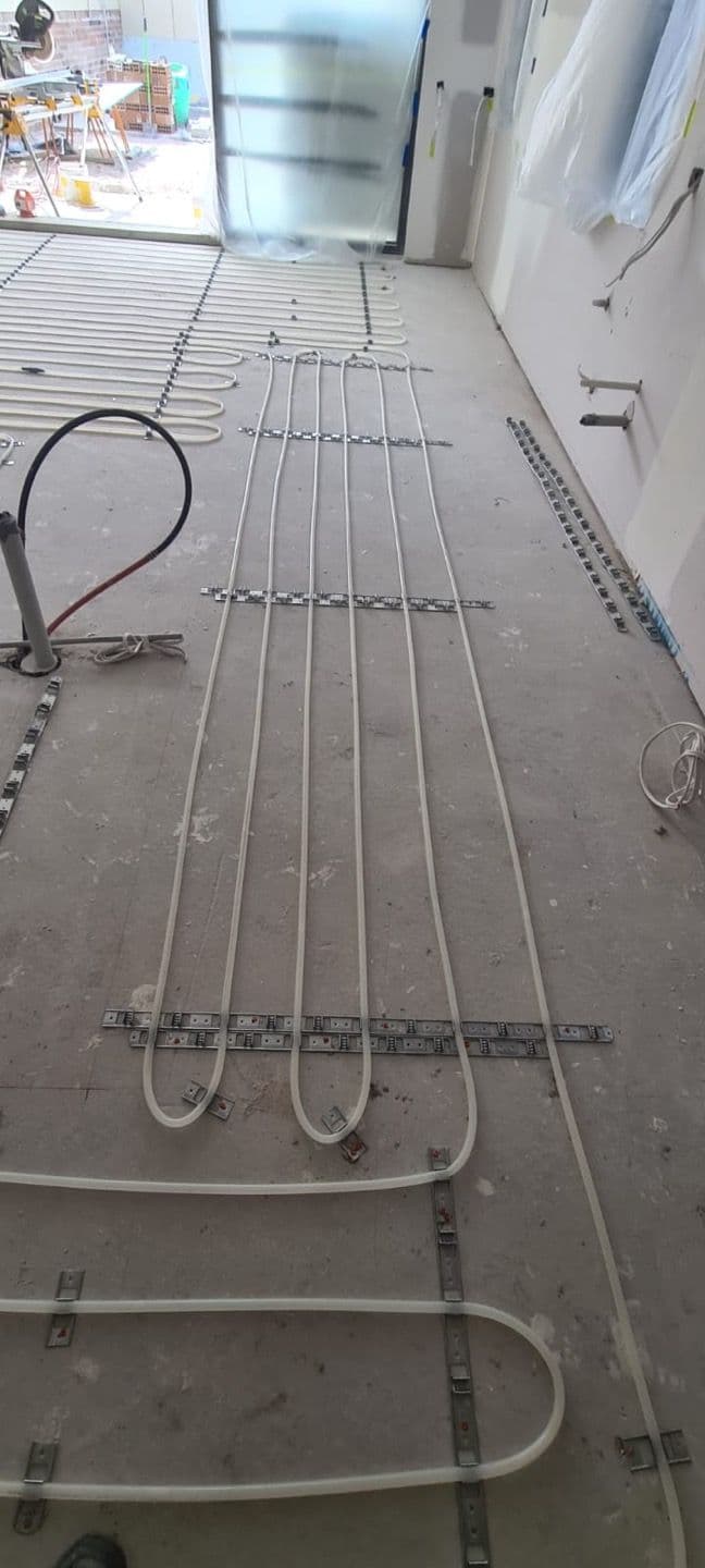 Multi-zone hydronic in-screed underfloor heating installation across a Matraville residence.