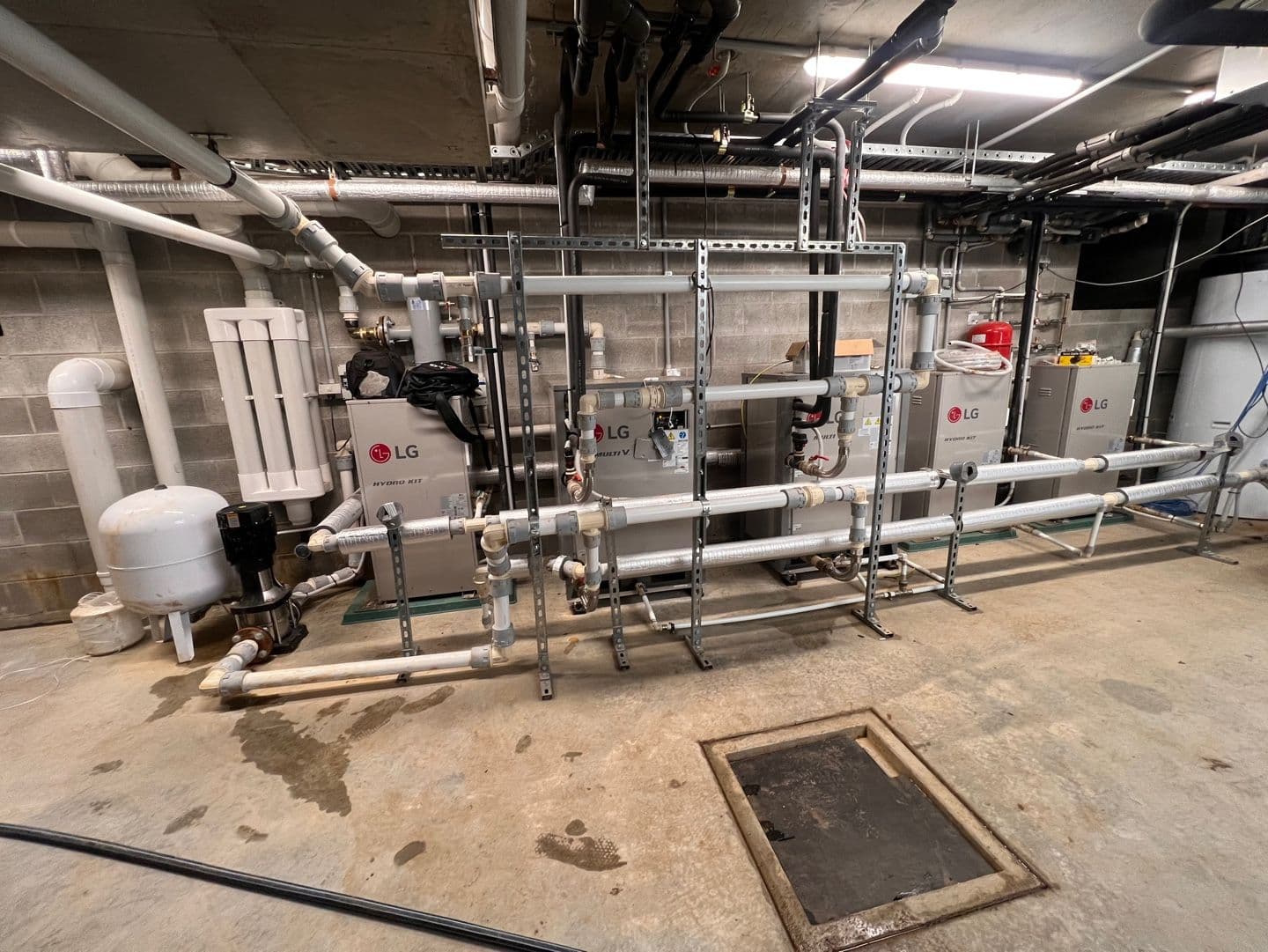 Geothermal plantroom with multiple hydronic units and insulated distribution pipework in Pokolbin.