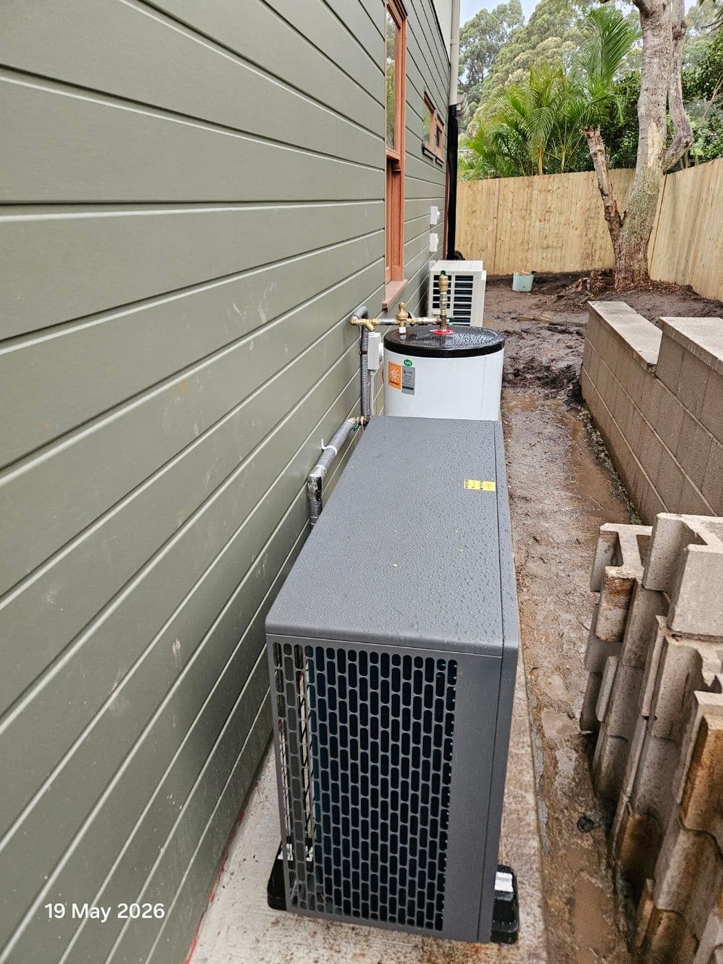 9kW R290 hydronic heat pump and buffer tank installed beside a Gladesville residence.