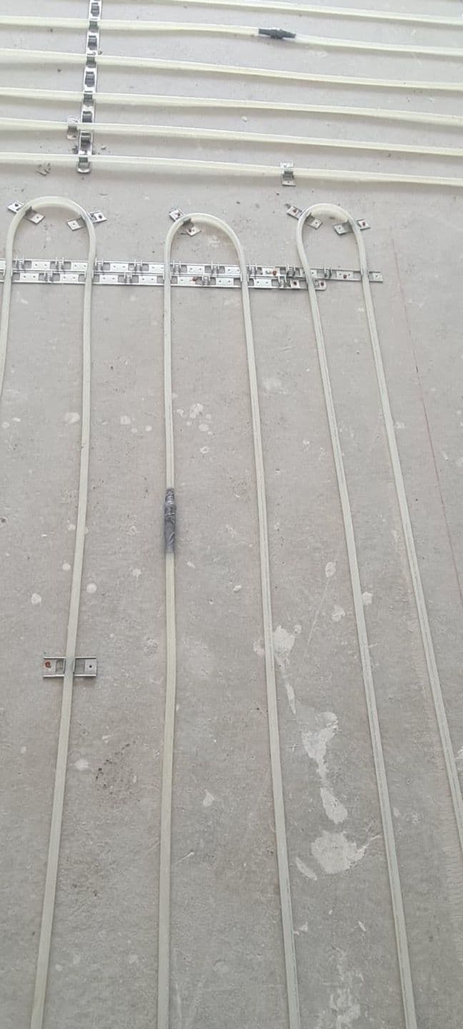 Hydronic underfloor heating pipes laid across an open-plan area in Matraville.
