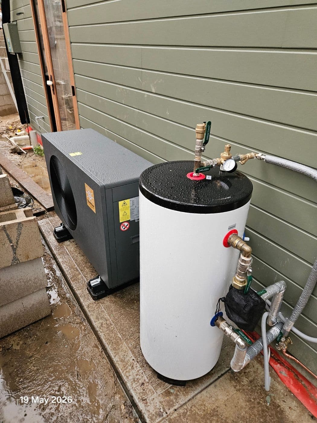 9kW residential hydronic heat pump installation with outdoor buffer storage in Gladesville.