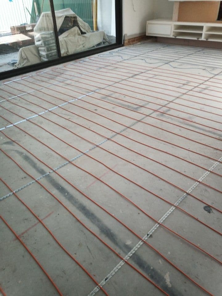 Evenly spaced electric heating cables installed across a Lilyfield living area.