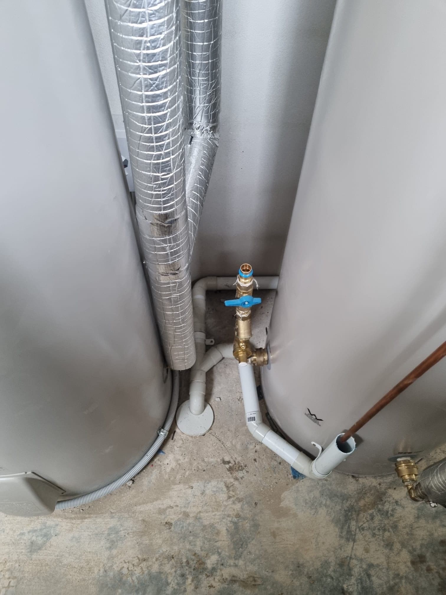 Panasonic domestic hot water system connected to insulated storage and circulation pipework in Pymble.